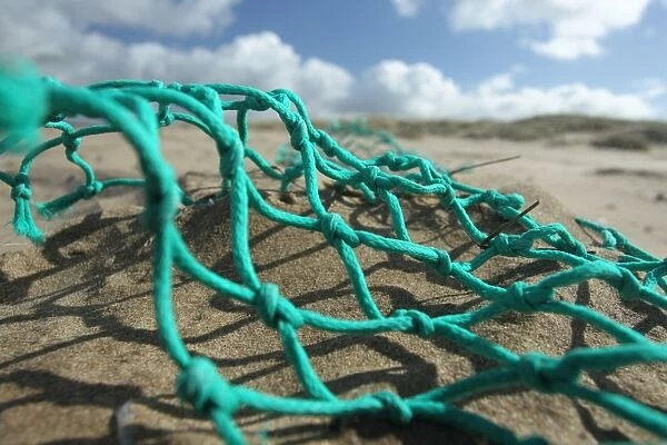 Trawl net washed up on beach, Gower Peninsula, West Glamorgan, Wales, March
