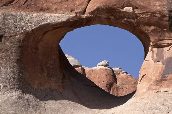 Tunnel Arch in Arches National Park, Utah. This arch is made from Entrada Sandstone which over time is eroded by water
