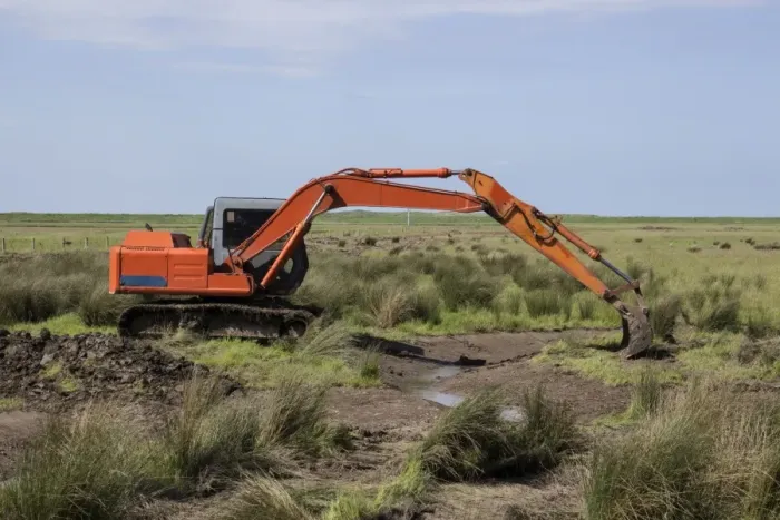 Framed Print : Using a digger excavator for habitat restoration work on Deepdale Marsh, Burnham Deepdale, North Norfolk Framed Print : Using a digger excavator for habitat restoration work on Deepdale Marsh, Burnham Deepdale, North Norfolk