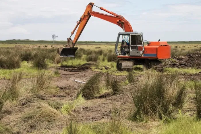 Framed Print : Using a digger excavator for habitat restoration work on Deepdale Marsh, Burnham Deepdale, North Norfolk Framed Print : Using a digger excavator for habitat restoration work on Deepdale Marsh, Burnham Deepdale, North Norfolk