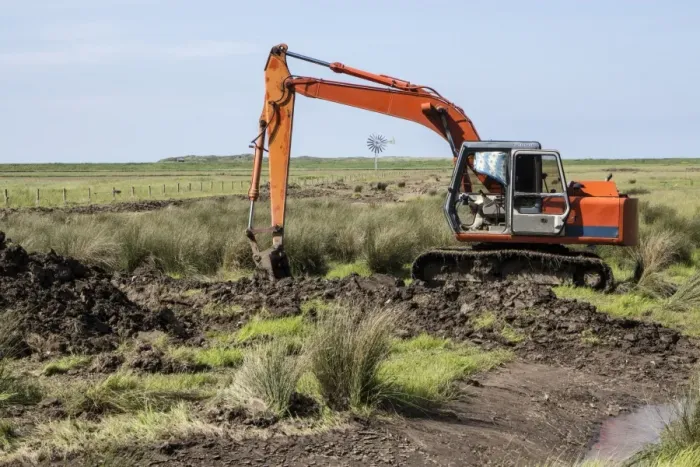 Framed Print : Using a digger excavator for habitat restoration work on Deepdale Marsh, Burnham Deepdale, North Norfolk Framed Print : Using a digger excavator for habitat restoration work on Deepdale Marsh, Burnham Deepdale, North Norfolk