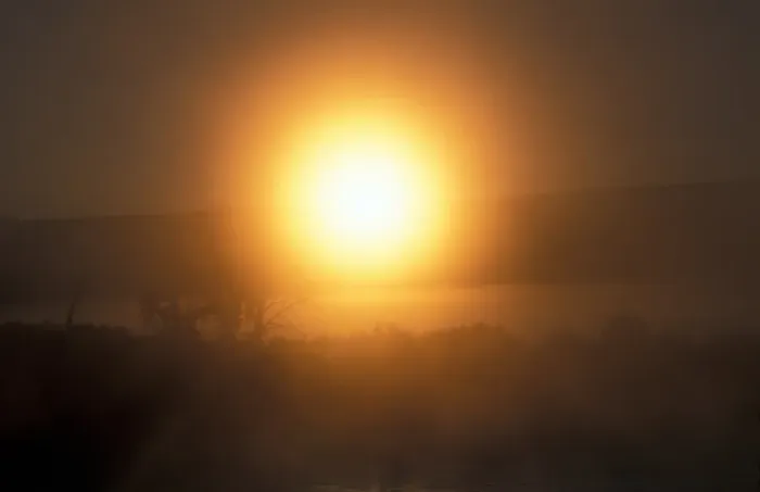 Framed Print : Utah Golden glow of the rising sun through stratus fog - Dinosaur National Park