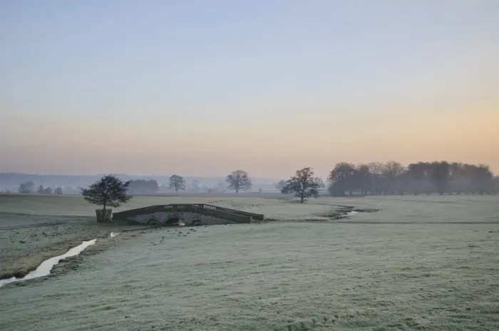 Framed Print : View of arched bridge over beck flowing through parkland at dawn, Hovingham Park, Hovingham, North Yorkshire, England Framed Print : View of arched bridge over beck flowing through parkland at dawn, Hovingham Park, Hovingham, North Yorkshire, England