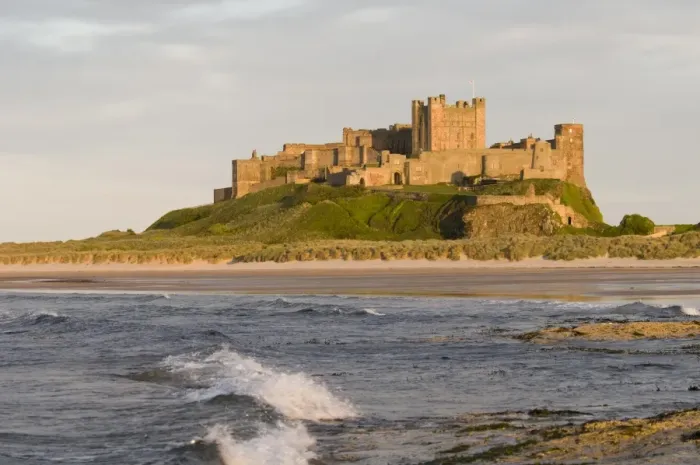 Framed Print : View across beach and sea towards castle, Bamburgh Castle, Northumberland, England, may Framed Print : View across beach and sea towards castle, Bamburgh Castle, Northumberland, England, may