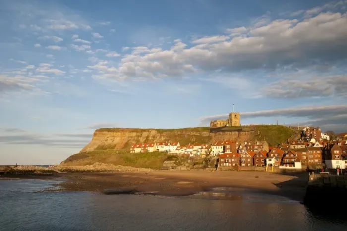 Framed Print : View of beach and seaside town in evening sunlight, with St. Marys Church on clifftop in background, East Cliffs Framed Print : View of beach and seaside town in evening sunlight, with St. Marys Church on clifftop in background, East Cliffs