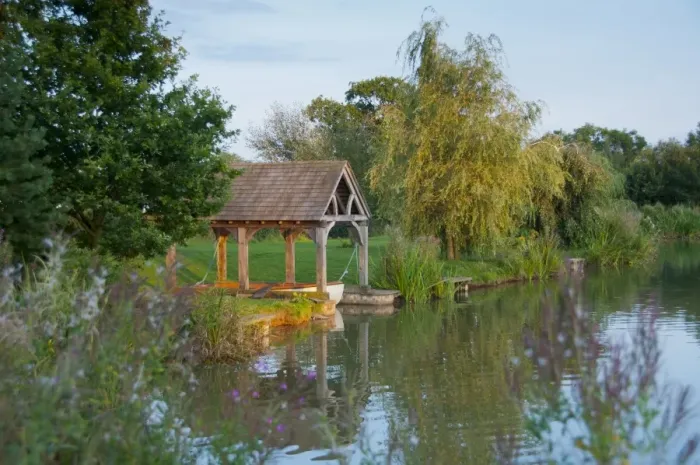 Framed Print : View of boathouse on fishing pond at sunset, Little Budworth, Tarporley, Cheshire, England, september Framed Print : View of boathouse on fishing pond at sunset, Little Budworth, Tarporley, Cheshire, England, september