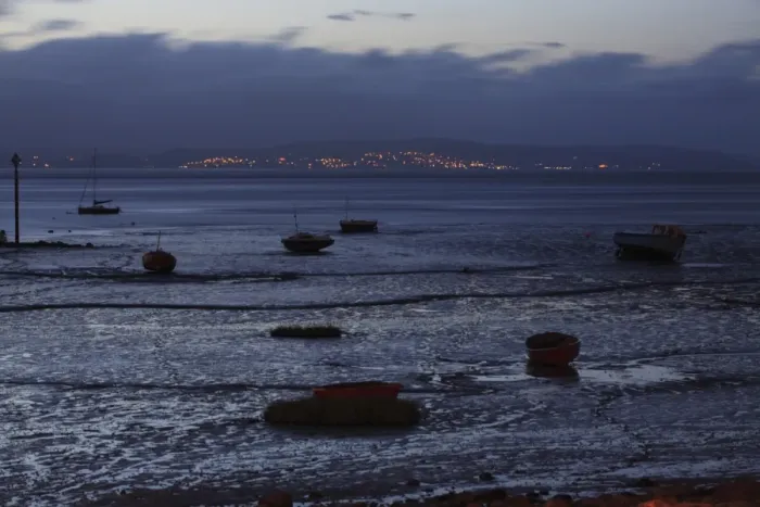 Framed Print : View of boats on intertidal mudflats habitat during low tide at night, looking towards Grange-over-sands in Cumbria Framed Print : View of boats on intertidal mudflats habitat during low tide at night, looking towards Grange-over-sands in Cumbria