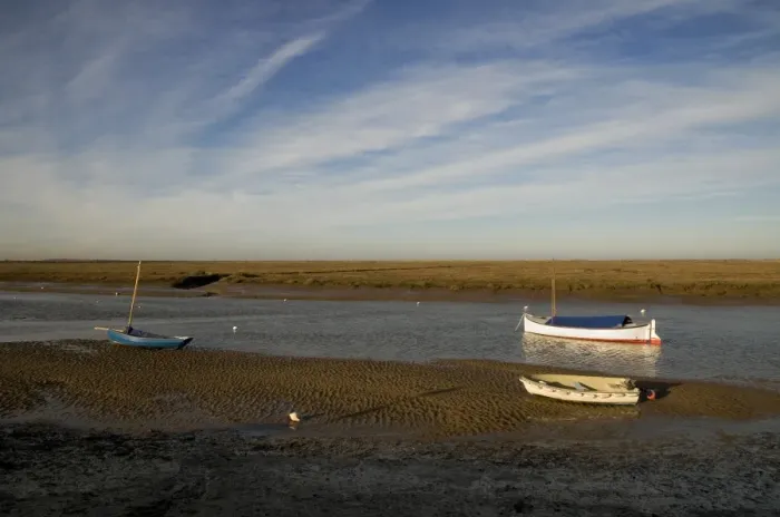 Framed Print : View of boats moored in coastal creek at low tide, Burnham Overy Staithe, Norfolk, England, december Framed Print : View of boats moored in coastal creek at low tide, Burnham Overy Staithe, Norfolk, England, december