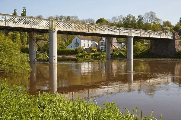 View of bridge with village on riverbank, Brockweir Bridge, Brockweir, River Wye, Lower Wye Valley, Forest of Dean