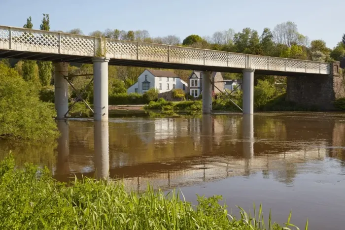 Framed Print : View of bridge with village on riverbank, Brockweir Bridge, Brockweir, River Wye, Lower Wye Valley, Forest of Dean Framed Print : View of bridge with village on riverbank, Brockweir Bridge, Brockweir, River Wye, Lower Wye Valley, Forest of Dean
