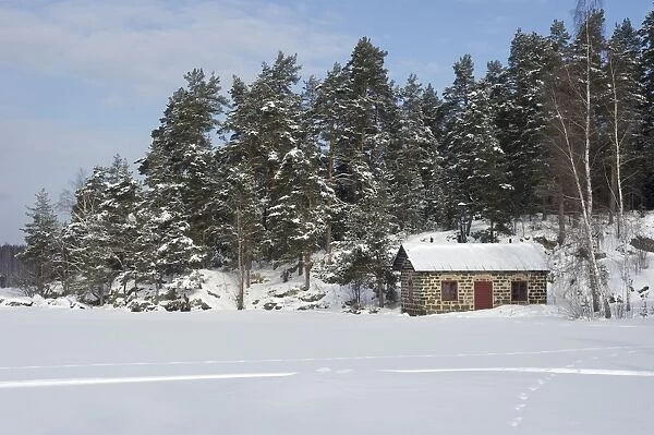 View of cabin in snow, Oljeon (Oil Island), Angelsberg, Fagersta Municipality, Vastmanland, Sweden, february