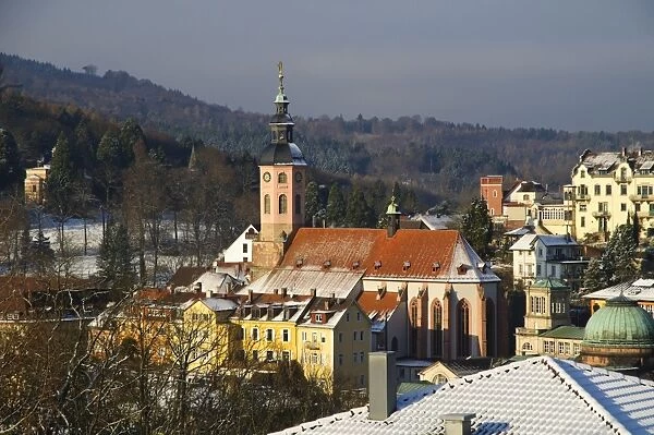 View of church and spa town in snow, Stiftskirche, Baden-Baden, Black Forest, Baden-Wurttemberg, Germany, December