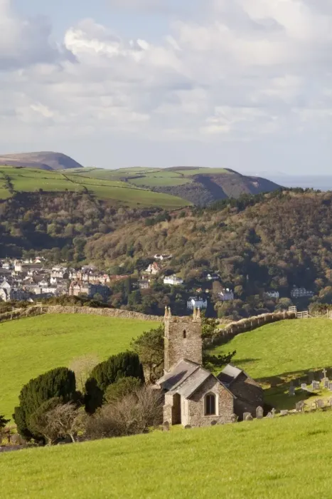Framed Print : View of church, village, woodland and coastline on sunny morning, Church of St Framed Print : View of church, village, woodland and coastline on sunny morning, Church of St