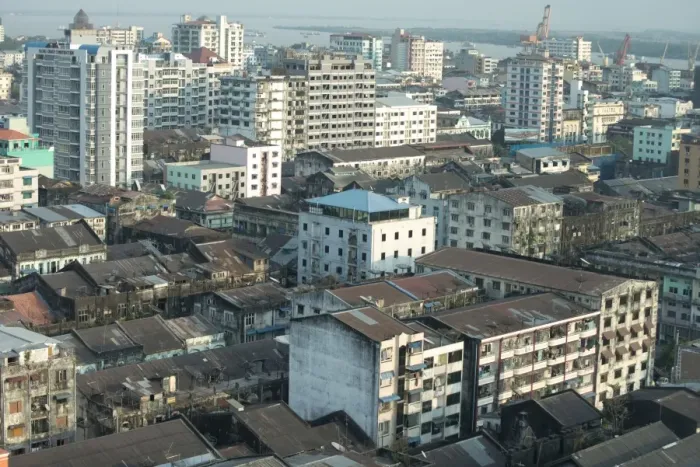 Framed Print : View across city rooftops (from Traders Hotel) towards river, Yangon, Myanmar, March
