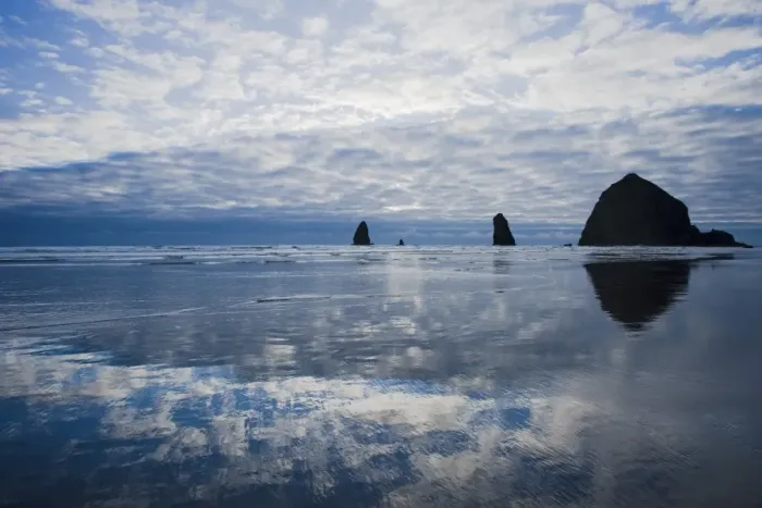 Framed Print : View of clouds reflected on shore and distant sea stacks at dusk, Cannon Beach, Oregon, U. S. A. july Framed Print : View of clouds reflected on shore and distant sea stacks at dusk, Cannon Beach, Oregon, U. S. A. july
