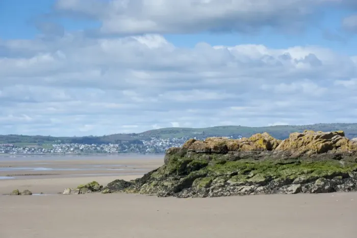 Framed Print : View of coast with rocky outcrop at low tide, looking towards Grange-over-sands, Silverdale, Morecambe Bay, Lancashire