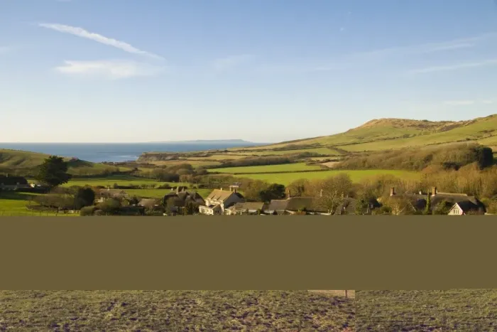 Framed Print : View over coastal farmland, with pasture, village houses and distant sea, Isle of Portland in distance, Kimmeridge Framed Print : View over coastal farmland, with pasture, village houses and distant sea, Isle of Portland in distance, Kimmeridge