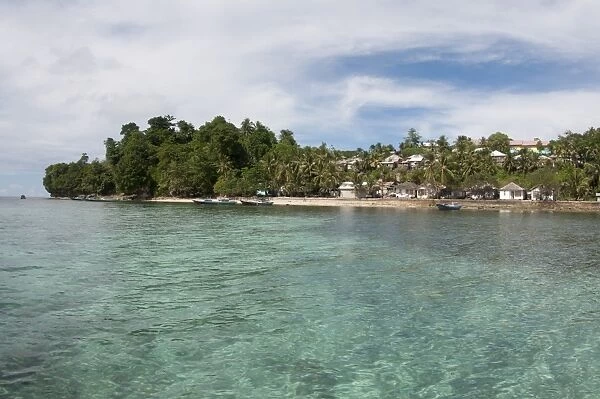 View of coastal settlement on tropical island, Run Island, near Bandaneira, near Ambon Island, Maluku Islands
