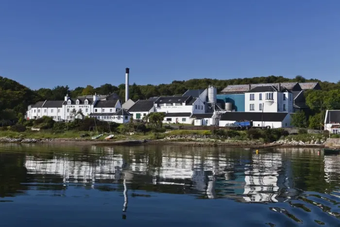 Framed Print : View of coastal village, Jura Hotel, Jura Distillery, Lodge and Cooperage viewed from sea, Craighouse, Isle of Jura Framed Print : View of coastal village, Jura Hotel, Jura Distillery, Lodge and Cooperage viewed from sea, Craighouse, Isle of Jura