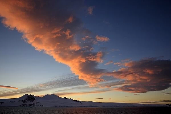 View of coastline and clouds at sunset, Weddell Sea, Antarctica, December
