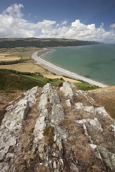 View of coastline looking from coast path on Hurlstone Point, with Worthy Wood and Porlock Common on distant hills