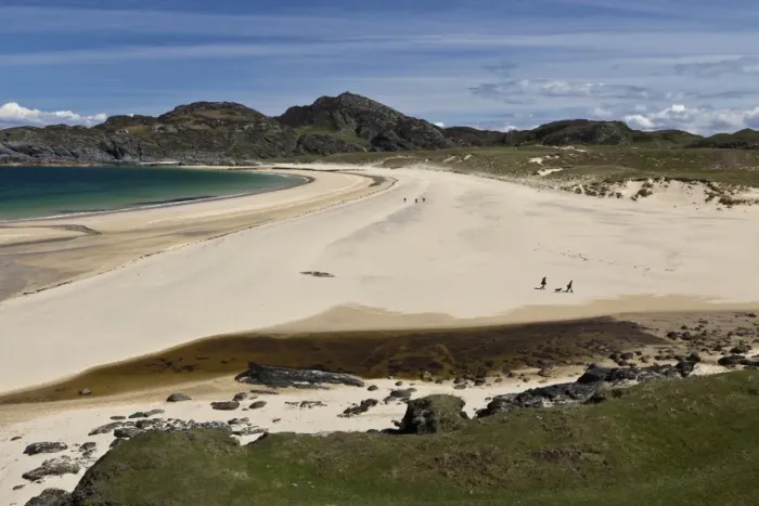 Framed Print : View of coastline with people walking on sandy beach, Kiloran Bay, Isle of Colonsay, Inner Hebrides, Scotland Framed Print : View of coastline with people walking on sandy beach, Kiloran Bay, Isle of Colonsay, Inner Hebrides, Scotland
