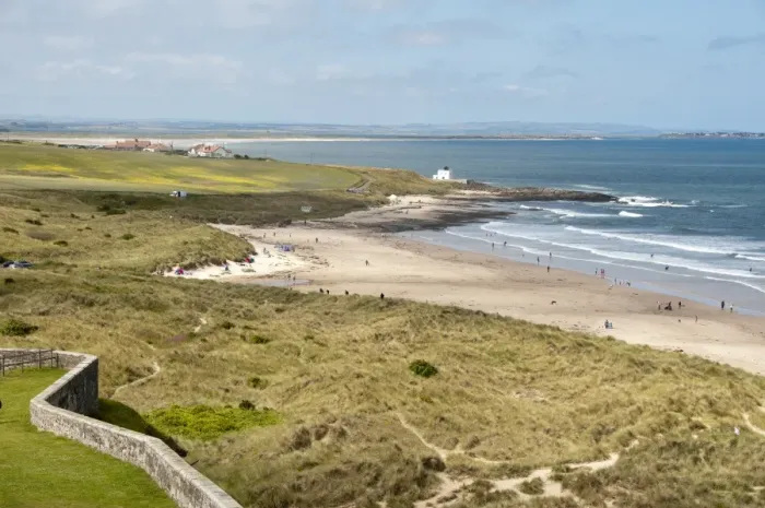 Framed Print : View of coastline with sand dunes and beach, Bamburgh, Northumberland, England, july Framed Print : View of coastline with sand dunes and beach, Bamburgh, Northumberland, England, july