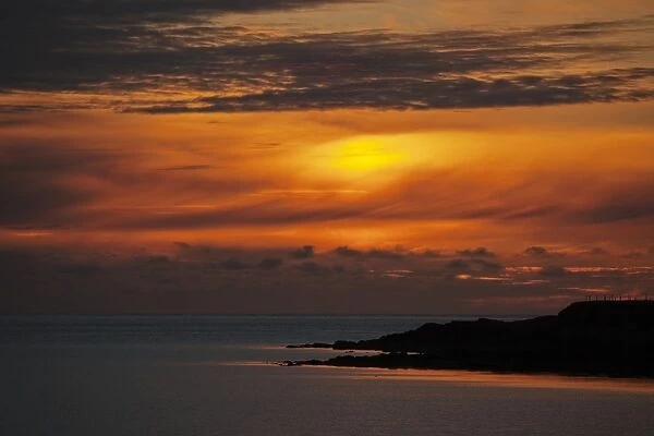 View of coastline at sunset, Westing Beach, Unst, Shetland Islands, Scotland, June