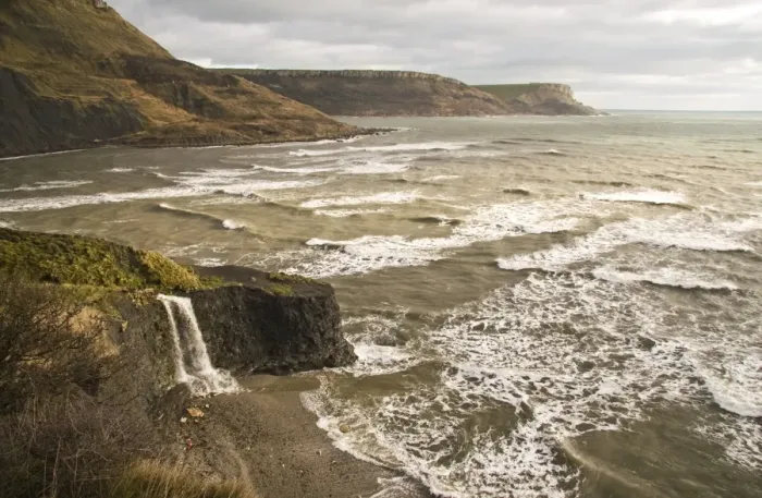 Framed Print : View of coastline with waterfall flowing over hard shale to beach on coast with rough sea, Freshwater Steps, Dorset Framed Print : View of coastline with waterfall flowing over hard shale to beach on coast with rough sea, Freshwater Steps, Dorset
