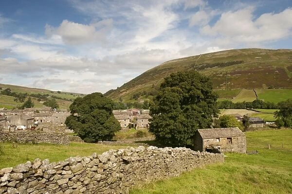 View of drystone walls and village, Thwaite, Swaledale, Yorkshire Dales, North Yorkshire, England, September