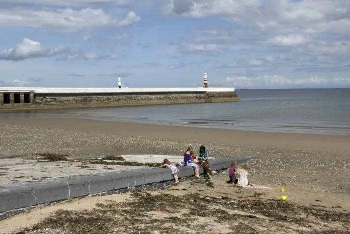 Framed Print : View of family on beach with jetty and lighthouse in background, Ramsey, Isle of Man, june Framed Print : View of family on beach with jetty and lighthouse in background, Ramsey, Isle of Man, june