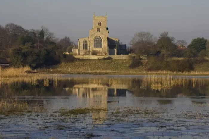 Framed Print : View across flooded grazing marsh towards church, St. Marys Church, Wiveton, Norfolk, England, march Framed Print : View across flooded grazing marsh towards church, St. Marys Church, Wiveton, Norfolk, England, march