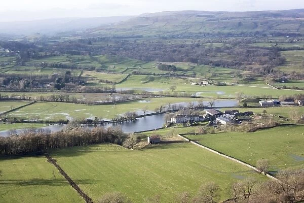 View of floodwater on valley farmland, looking up Wensleydale from above West Burton, North Yorkshire, England
