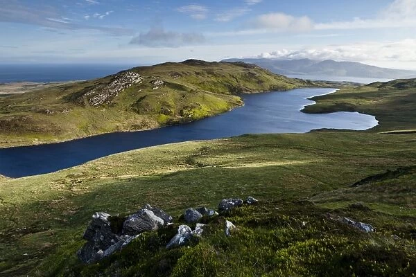 View of freshwater loch and coastline, viewed from halfway up Dubh Bheinn across east coast of Islay