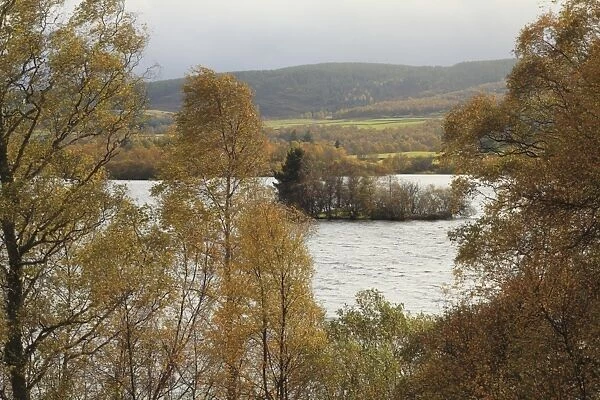 View of freshwater loch with crannog (prehistoric artificial island), Loch Kinord