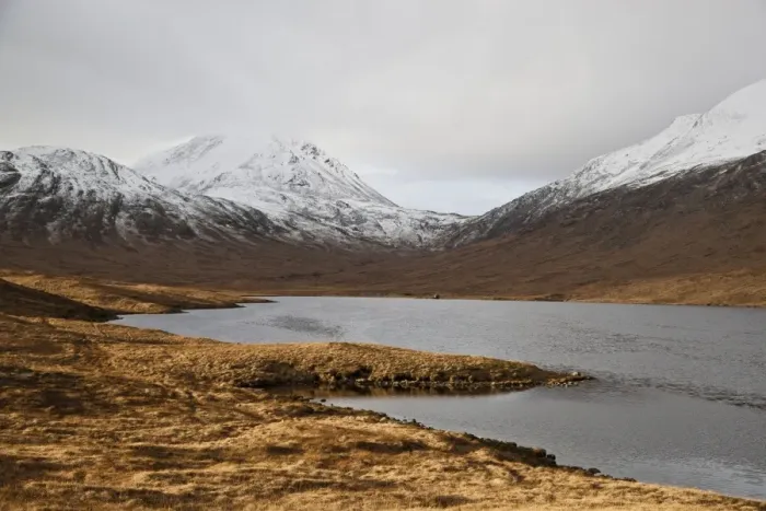 Framed Print : View across freshwater loch towards fishing hut, with snow covered mountain peak in background, Loch an t-Siob Framed Print : View across freshwater loch towards fishing hut, with snow covered mountain peak in background, Loch an t-Siob