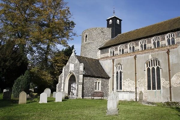 View of graveyard and church with Norman round-tower, largest Norman round-tower in country, St