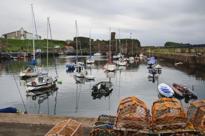 Framed Print : View of harbour with lobster pots, boats and ruined castle in background, Dunbar Castle, Dunbar Harbour, Dunbar Framed Print : View of harbour with lobster pots, boats and ruined castle in background, Dunbar Castle, Dunbar Harbour, Dunbar