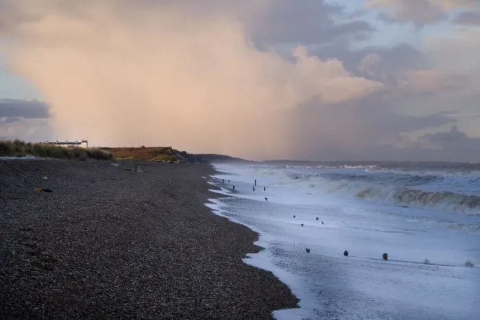 Framed Print : View of incoming tide over shingle beach, with stormclouds over old Coastguards cottages of Dunwich Heath in Framed Print : View of incoming tide over shingle beach, with stormclouds over old Coastguards cottages of Dunwich Heath in