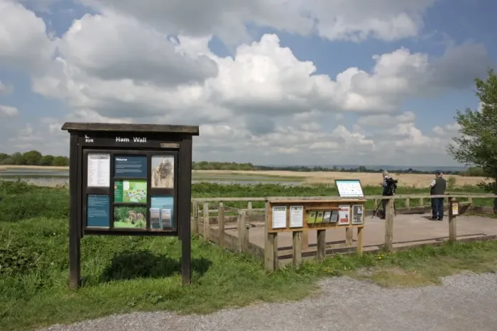 Framed Print : View of information board, viewing platform and wetland habitat in nature reserve