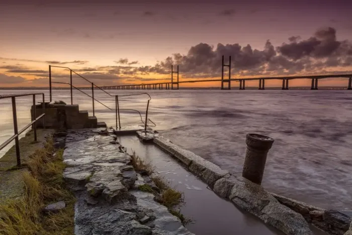 Framed Print : View of jetty and road bridge at sunrise, Sudbrook Jetty, Second Severn Crossing, River Severn, Severn Estuary