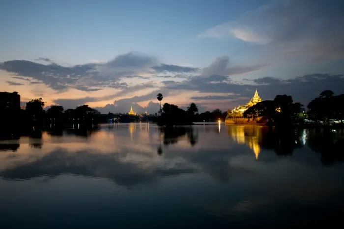 Framed Print : View of Karaweik (concrete reproduction of royal barge) and Shwedagon Pagoda across lake at sunset, Kandawgyi Lake