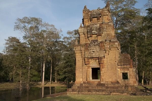 View of Khmer temple tower beside pond, Prasat Suor Prat Tower Complex, Angkor Thom, Siem Riep, Cambodia