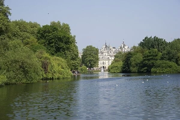 View across lake in urban parkland towards Horse Guards, St. Jamess Park Lake, St