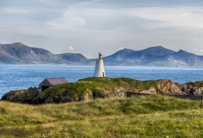 Framed Print : View of lighthouse and coastline on tidal island, Llanddwyn Island, Newborough Warren National Nature Reserve Framed Print : View of lighthouse and coastline on tidal island, Llanddwyn Island, Newborough Warren National Nature Reserve