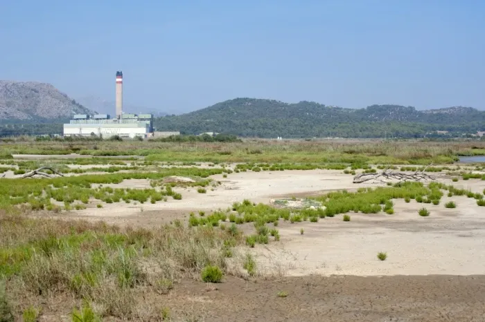 Framed Print : View of marshland habitat with Es Murterar coal-fired powerstation in distance,s Albufera De Mallorca Natural Park