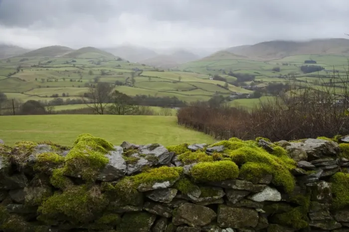 Framed Print : View over moss covered drystone wall towards fell with low clouds, looking towards Howgill Fells, Firbank, Cumbria