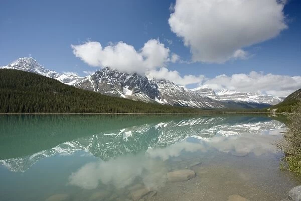 View of mountain reflected in lake, Mount Noyes, Waterfowl Lake, Banff N. P. Rocky Mountains, Alberta, Canada, june