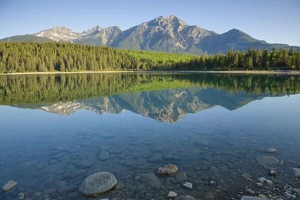 View of mountain reflected in lake, Pyramid Mountain, Patricia Lake, Jasper N. P. Rocky Mountains, Alberta, Canada, june