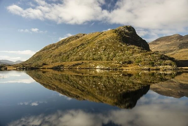View of mountain reflected in narrow channel connecting lakes, The Long Range, Lakes of Killarney